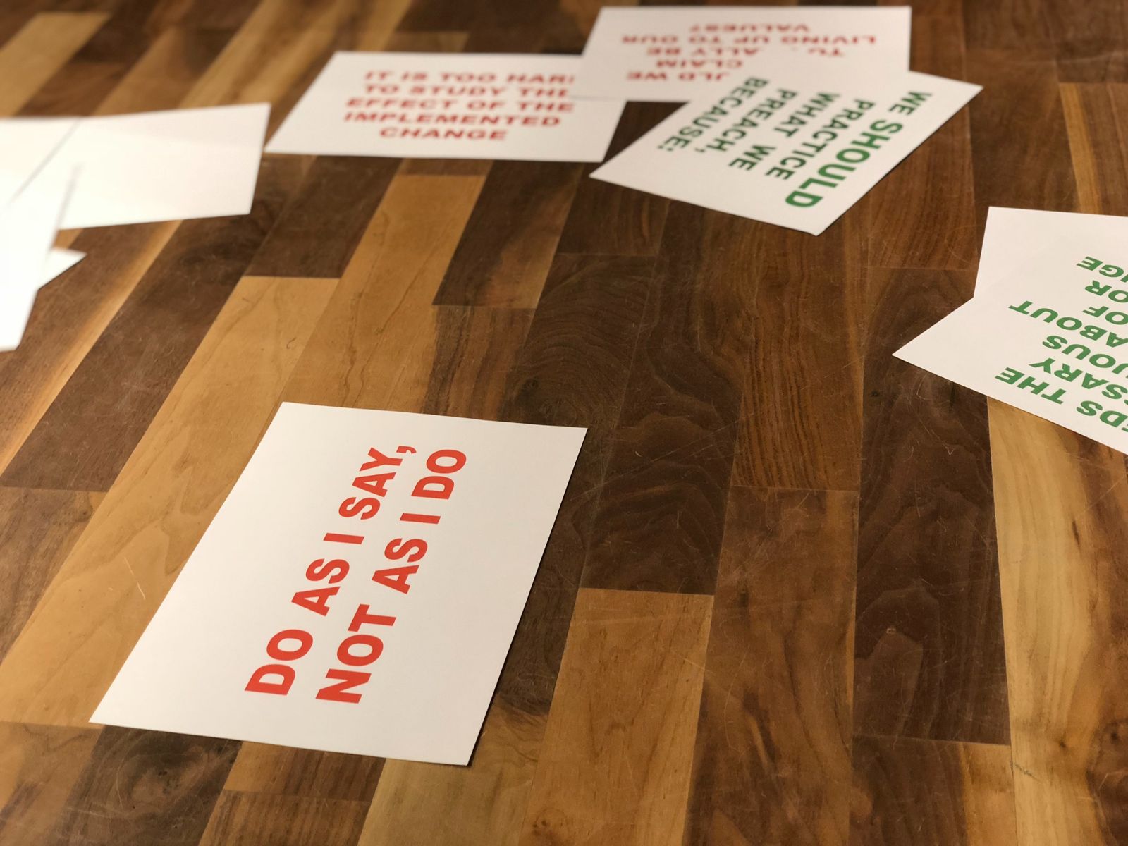 A Mendix SDK Primer — Part 2_image of a wooden surface with several cards on it, one card contains the phrase- do as I say not as I do